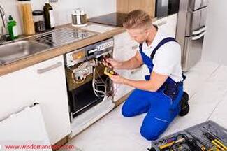 Electrician installing oven